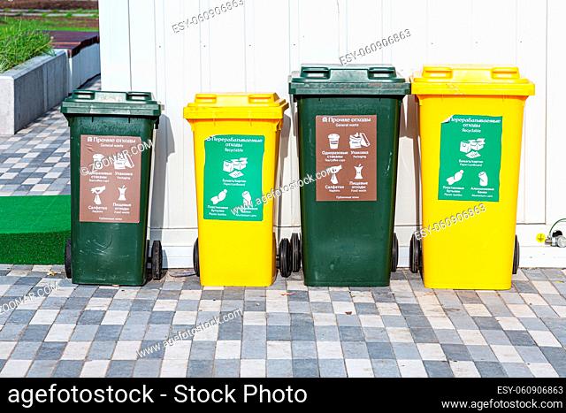 Samara, Russia - September 16, 2018: Separation bins according to waste type. Separate garbage containers on city street