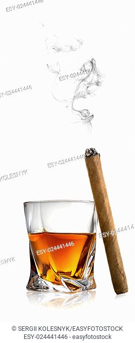 Whiskey and cigar isolated on a white background