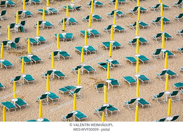 Italy, Jesolo, Deserted beach with deck chairs, elevated view