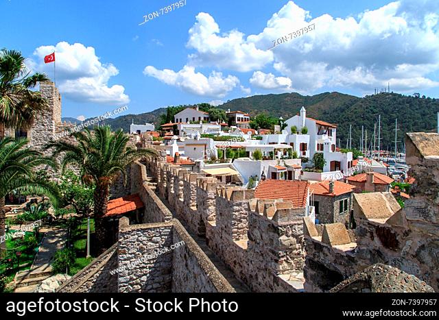 MUGLA, TURKEY - JUNE 1, 2015 : View of Marmaris town and marina from old historical Marmaris Tower, on blue sky background
