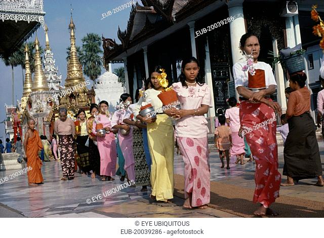 Shwedagon Pagoda. Line of young women with offerings