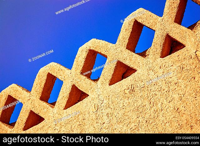 Rammed earth wall with beautiful blue sky