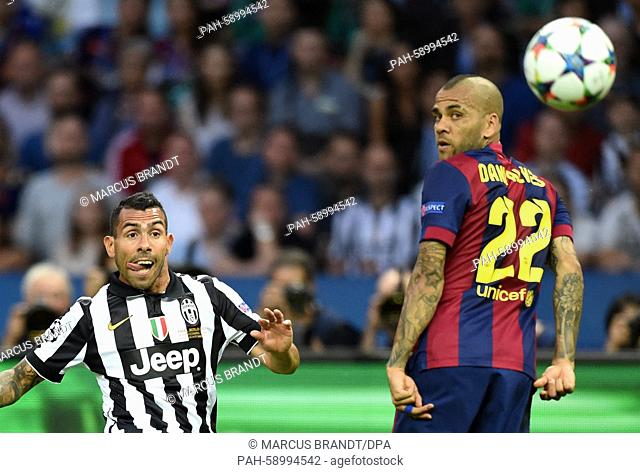 Carlos Tevez of Juventus (L) and Dani Alves of Barcelona vie for the ball during the UEFA Champions League final soccer match between Juventus FC and FC...