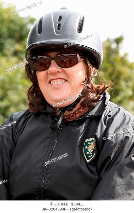 Portrait of woman with visual impairment at riding lesson
