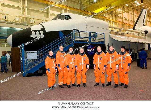 The STS-123 crewmembers take a break from a training session to pose for a photo in the Space Vehicle Mockup Facility at the Johnson Space Center