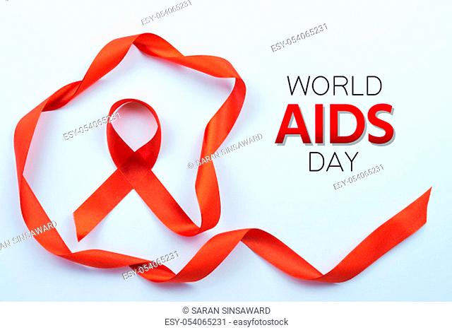 Aids awareness, red ribbon on white background with copy space for text. World Aids Day, Healthcare and medical concept