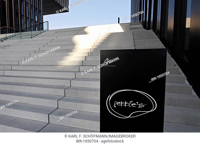 Sign showing the way to the Pebbles Bar in front of a wide flight of stairs, Hafenspitze, Medienhafen harbour, Duesseldorf, North Rhine-Westphalia, Germany