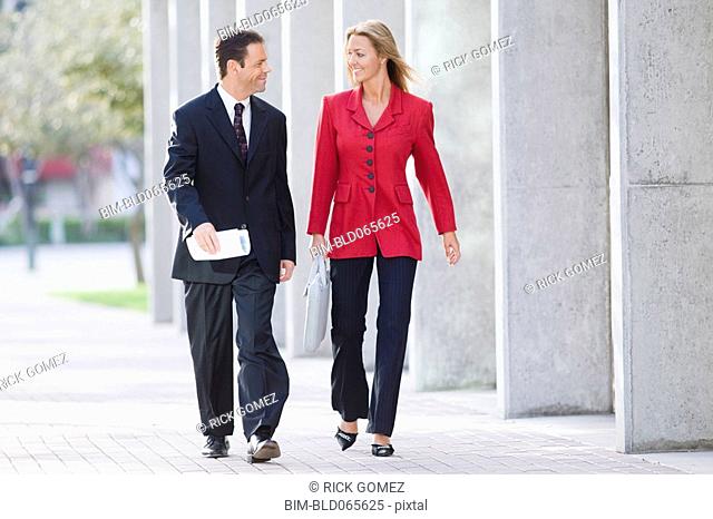 Businesspeople walking together outdoors