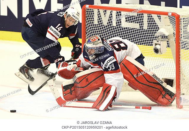 From left American forward Steve Moses and Slovakian goalkeeper Julius Hudacek in action during the Hockey World Championships Group B match USA vs Slovakia in...