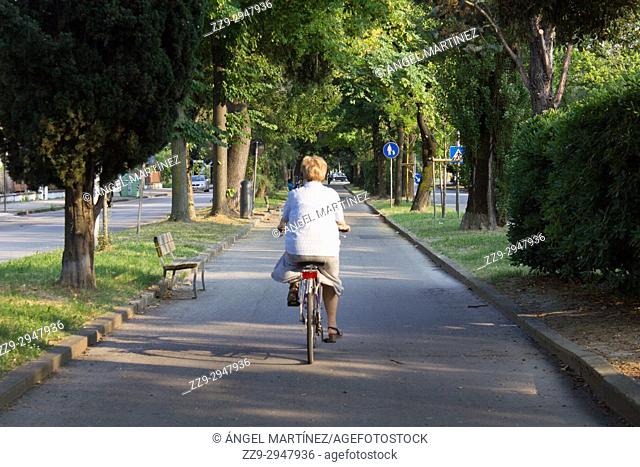 woman cycling in marghera, Italy