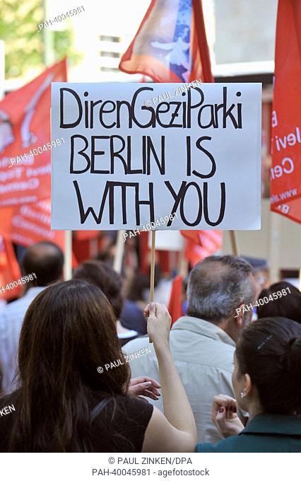 A woman holds a poster outside of the Turkish Embassy in Berlin,  Germany, 06 June 2013. The Alevi community in Berlin called for a rally to show solidarity...