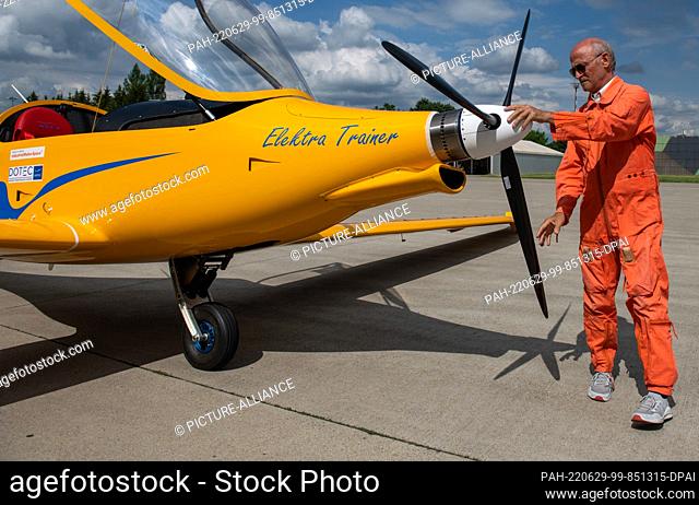29 June 2022, Bavaria, Memmingerberg: At Allgäu Airport, pilot Uwe Nortmann checks the propeller on the electric aircraft ""Elektra Trainer"" before its maiden...