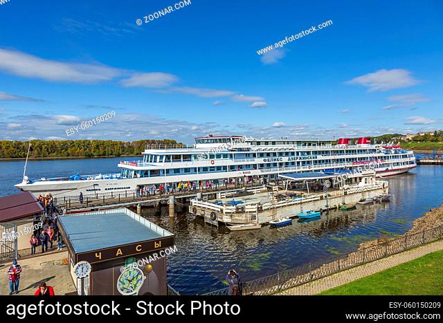 Uglich, Russia - September 11, 2021: White four-deck cruise ship Felix Dzerzhinsky in the city river port. Built in Czechoslovakia in 1978