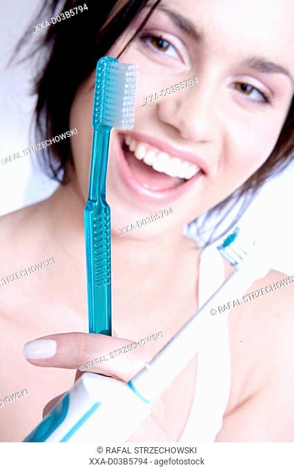 woman choosing toothbrush