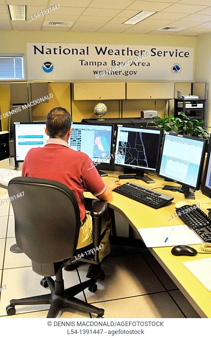Meteorologist in Work Area in Doppler Radar National Oceanic and Atmospheric Administration NOAA National Weather Service Station Ruskin Florida Tampa...