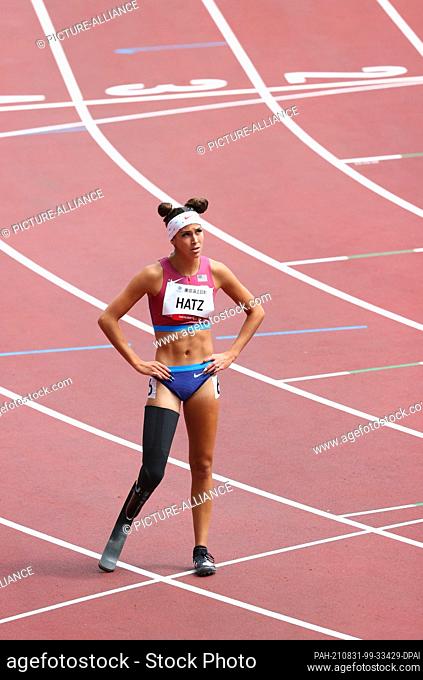 31 August 2021, Japan, Tokio: Paralympics: Athletics, women's 200 metres preliminary heat, at the Olympic Stadium. Beatriz Hatz from the USA has crossed the...