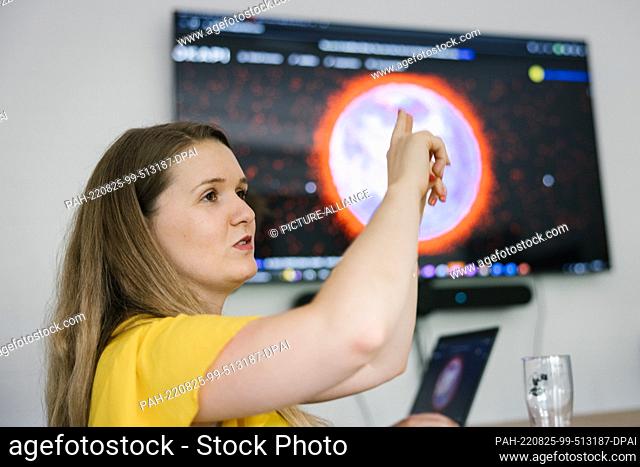25 August 2022, Lower Saxony, Brunswick: Kristina Nikolaus, CEO and founder of the aerospace startup Okapi Orbits speaks during the visit of Omid Nouripour