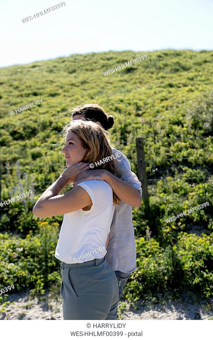Young couple taking a walk in the dunes