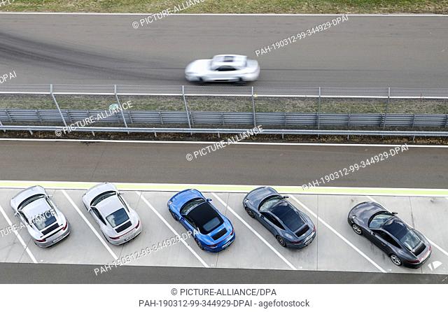 12 March 2019, Saxony, Leipzig: A Porsche Macan drives over the test track of the Porsche factory Leipzig. Porsche is investing more than 600 million euros in...