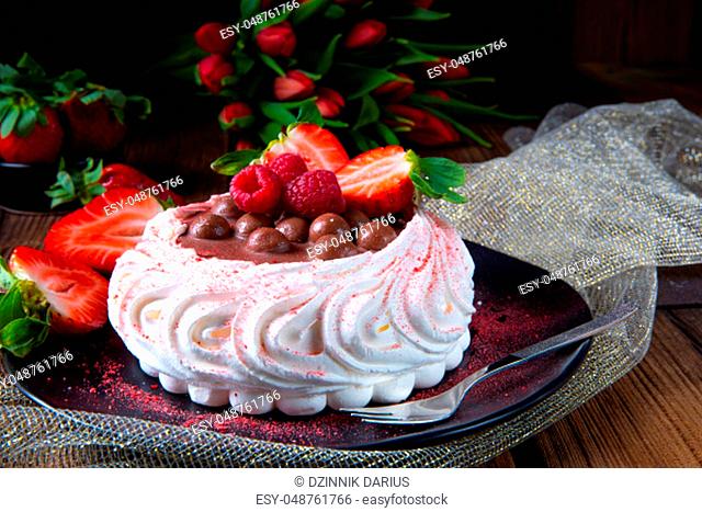 light pavlova with fresh fruits and chocolate