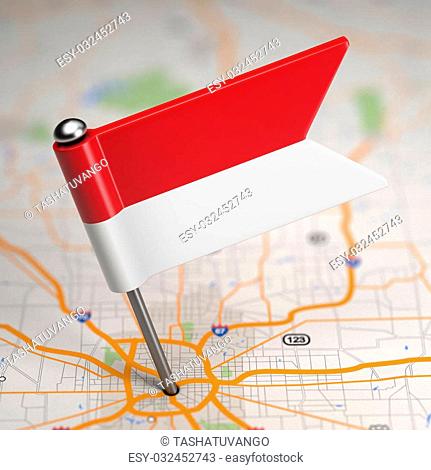 Small Flag of Monaco on a Map Background with Selective Focus