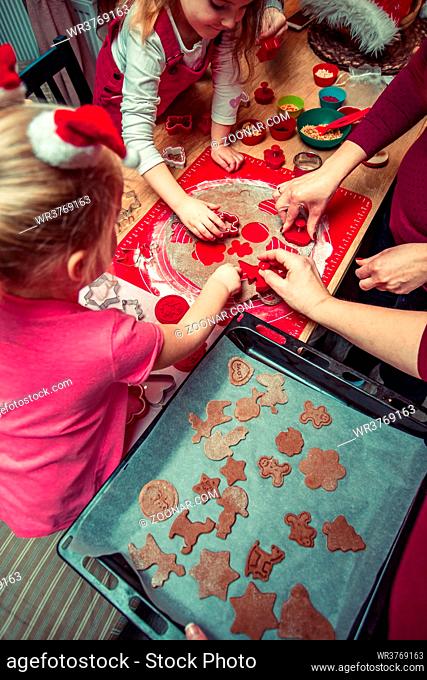 Baking Christmas cookies. Christmas gingerbread cookies in many shapes decorated with colorful frosting, sprinkle, icing, chocolate coating, toppers