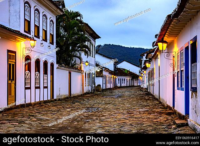 View of the historic city of Paraty at dusk with the lighting of its cobblestone streets and houses already lit
