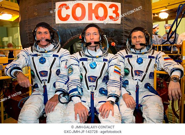 Expedition 49 flight engineer Shane Kimbrough of NASA, left, Soyuz commander Sergey Ryzhikov, center, and flight engineer Andrey Borisenko of Roscosmos, right