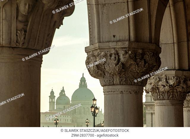 Afternoon in the sestier of San Marco, Venice, Italy. Santa Maria della Salute church in the distance