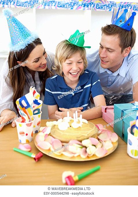 Cute little boy celebrating his birthday in the kitchen