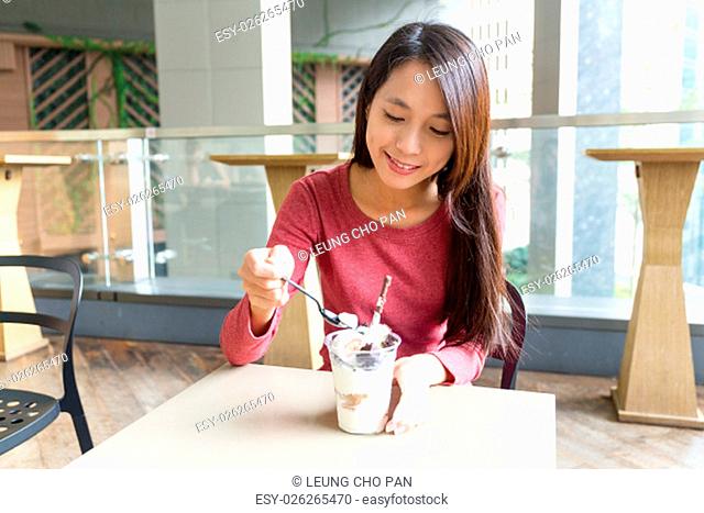 Happy girl eating ice cream