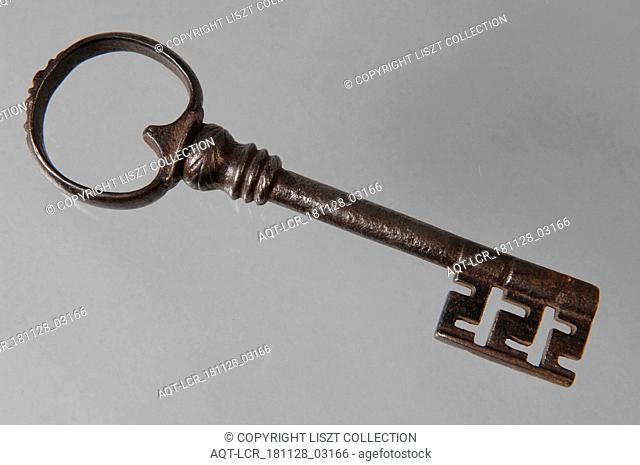 Slightly decorated iron key with heart-shaped eye, hollow key handle, decorated collar and beard with cross-shaped notches, key iron value iron