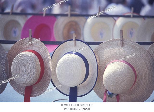 Straw hats hung up