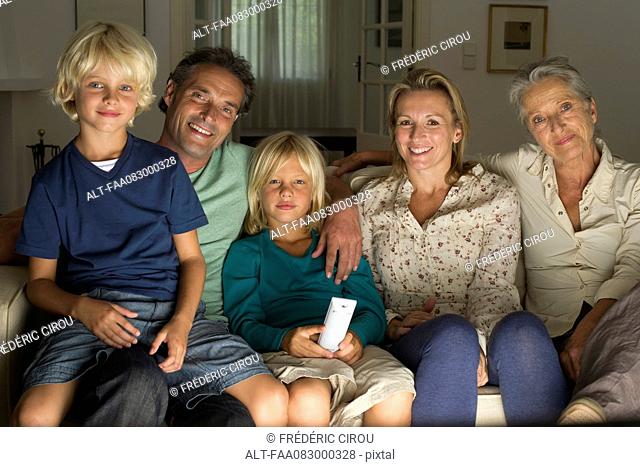 Multi-generation family watching TV together, portrait