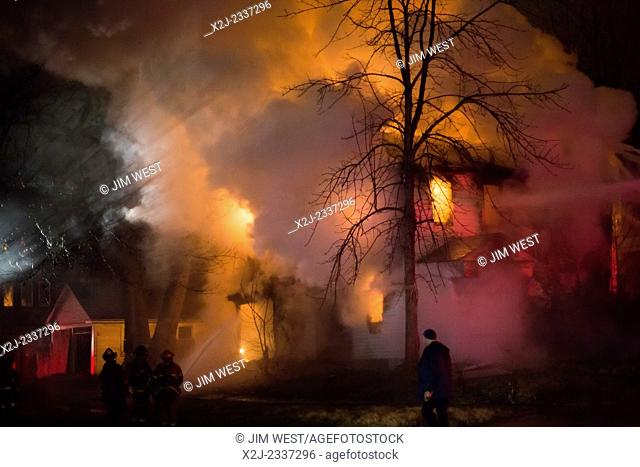 Detroit, Michigan - Firefighters battle a fire which destroyed a vacant home in Detroit's Morningside neighborhood. The city has tens of thousands of vacant...