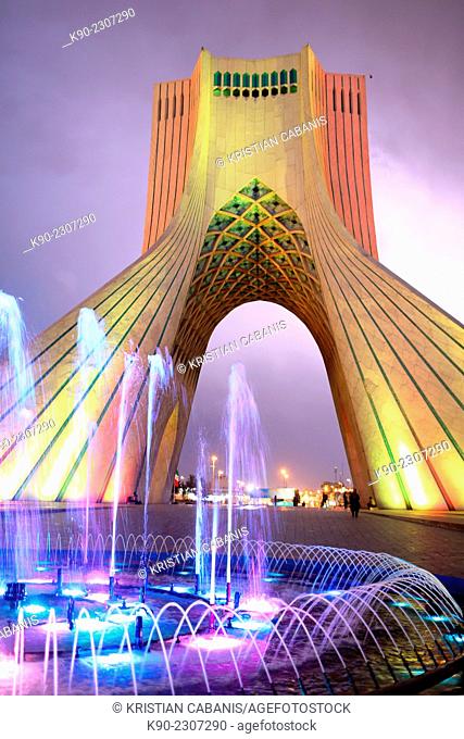 Azadi Tower with a blue fountain in the foreground, Borj-e Azadi, Tehran, Iran, Asia