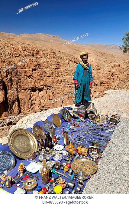 Dealer at his souvenir stand above the Dades Gorge, Atlas, Morocco