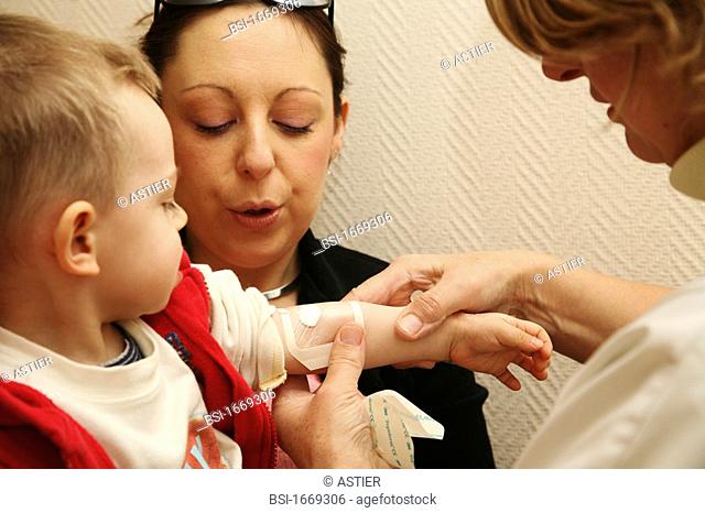 CHILD AT HOSPITAL CONSULTATION<BR>Photo essay from Regional University Hospital in Lille, France.<BR>Consultation with a doctor pneumologist allergologist