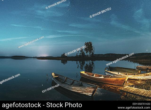 Real Starry Sky And Night Stars Above Lake. Natural Starry Sky Reflection Landscape