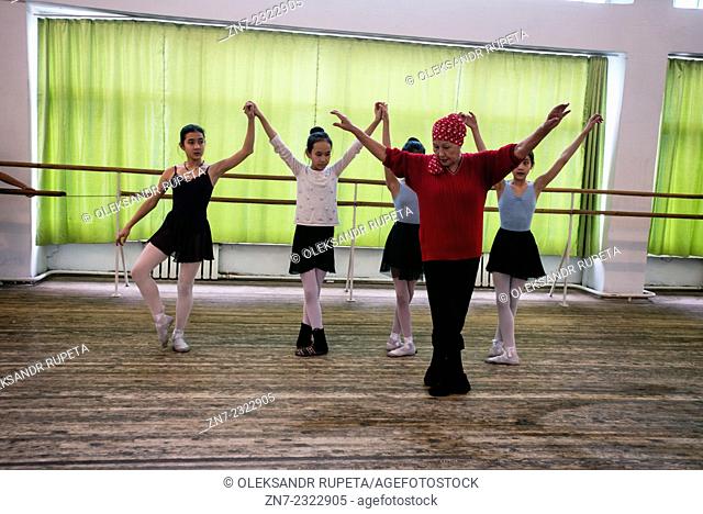 Teacher Jamal Ibrahimovna trains her students during rehearsal of first act of the Nutcracker, ballet scored by Pyotr Tchaikovsky in Bishkek choreographic...