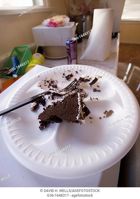Half-eaten cake in dirty kitchen in a foreclosed house in Huntington Park, California, United States