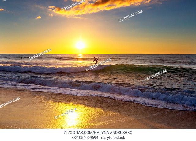 Hawaiian surfing beach at sunset