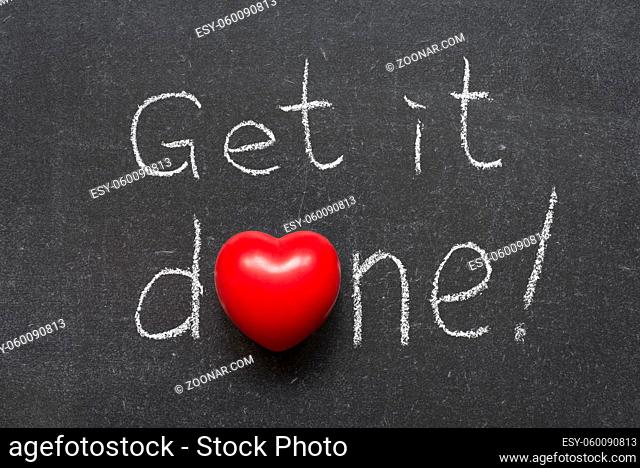 get it done exclamation handwritten on chalkboard with heart symbol instead of O