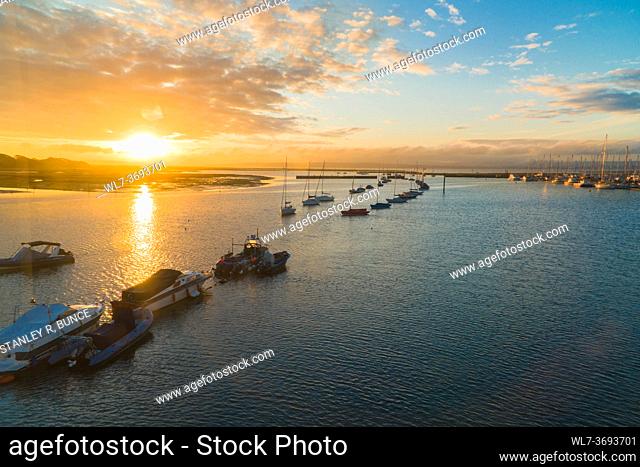 Sunrise over Lymington harbour taken from ferry, Hampshire UK. October 2020