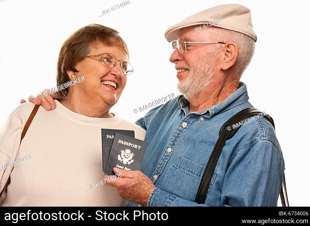 Happy senior couple with passports and bags isolated on a white background