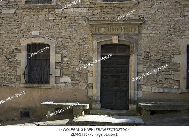 A village scene with detail of the old post office in the medieval village of Goult in the Luberon, Provence-Alpes-Cote d Azur region in southern France