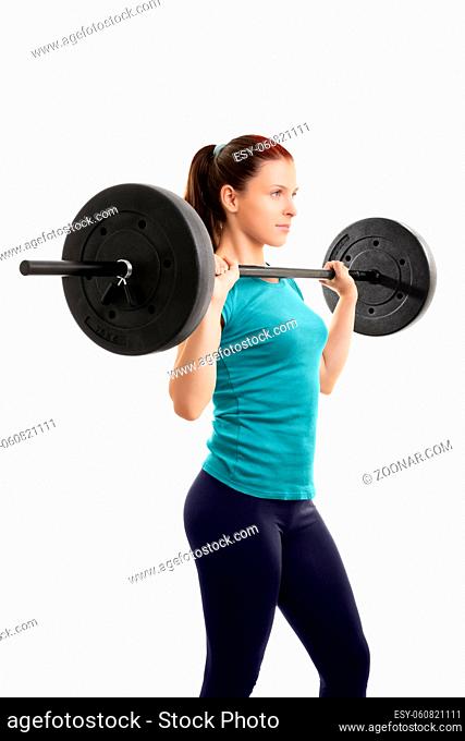 A portrait of a beautiful fit girl working out with a barbell, isolated on a white background