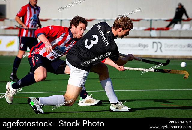 Leopold's Tom Degroote and Racing's Romain Delavignette fight for the ball during a hockey game between Royal Leopold Club and Royal Racing Club Bruxelles