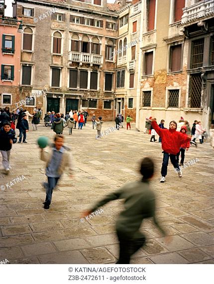 Children playing dodgeball at school, Venice, Veneto province, Italy, Europe