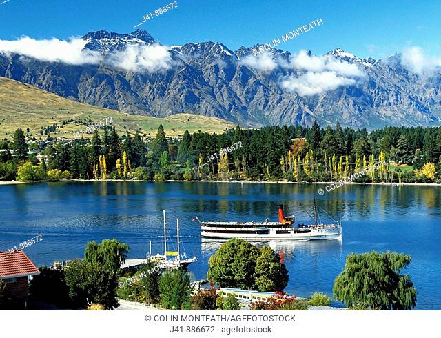 Steamship 'Earnslaw' heading out on Lake Wakatipu the Remarkables behind New Zealand